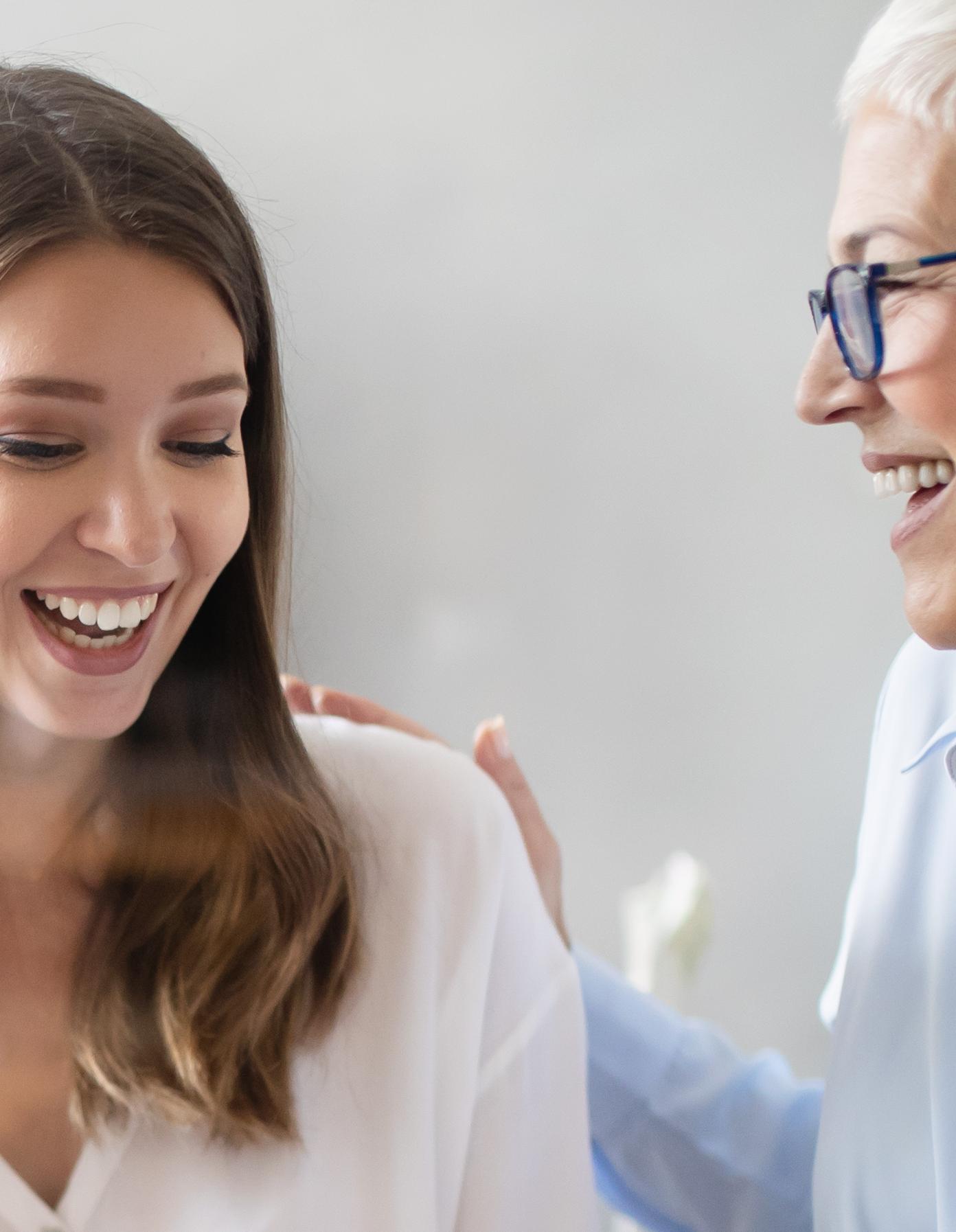 Two women smilling 