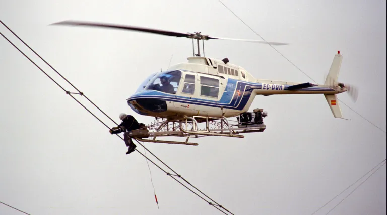 Replacement of cable separators via a platform attached to a helicopter