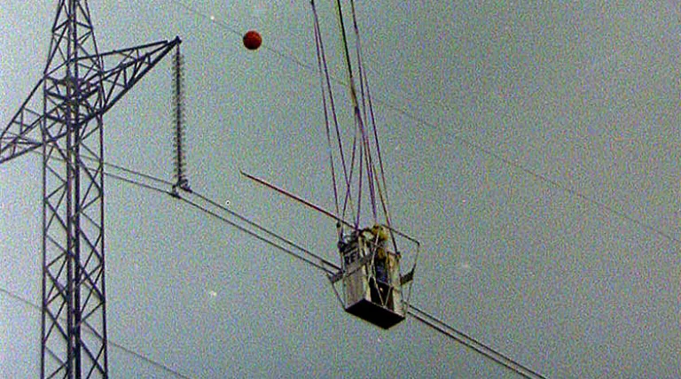 Maintenance works via a gondola suspended from a helicopter