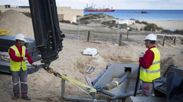 Drag works of the submarine section of the cable, in Cala Mesquida, of the new electricity link Menorca-Majorca, to connect it up with the land section of the cable.