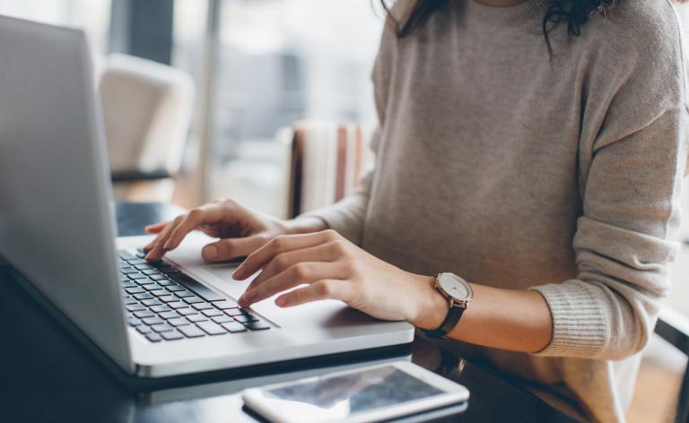 A person using laptop keyboard